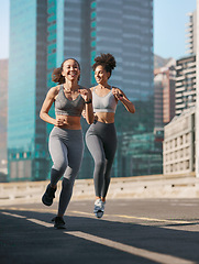 Image showing Fitness, woman and friends running in the city for cardio exercise, training or workout together in the outdoors. Happy active women enjoying a run for a healthy balanced lifestyle in Cape Town