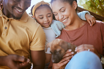 Image showing Black family dog, child and parents with pet, new puppy or black people play with happy family animal. Love support, happiness and owner pet care from kid girl, father and mother in outdoor backyard