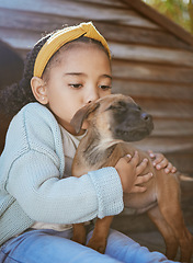 Image showing Child, pet animal and kiss for love, care and happiness for dog, fun friend or partner. Black girl outdoor for adoptoion with healthy rescue puppy for development to learn responsibility and kindness