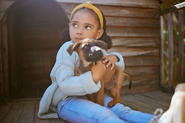 Image showing Girl child, animal shelter and dog hug, love and care while thinking about adoption. Pet, charity and kid hugging, embrace or cuddle with foster puppy, bonding and contemplating support for animal.