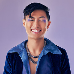 Image showing Fashion, color and man in studio for punk, retro and pop art style while feeling happy with makeup and vintage clothes on a purple background. Lgbtq, gen z and asian aesthetic model with makeup