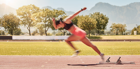 Image showing Sprinting, sports and woman training at a stadium for fitness, exercise and cardio with energy. Running, speed and athlete runner moving with power, fast and action for a race or competition