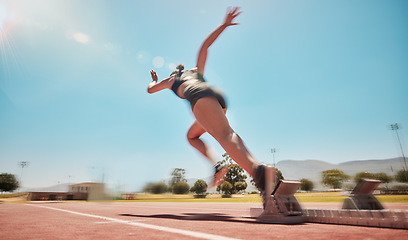 Image showing Speed, track start and woman running for marathon race workout, fitness or exercise for leg power action. Health commitment, blue sky flare and fast sports girl, athlete or cardio runner training