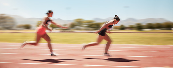 Image showing Sports, fitness and relay race with a woman athlete passing a baton to a teammate during a track race. Running, teamwork and health with a female runner and partner racing for competitive sport