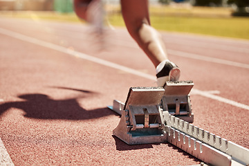 Image showing Sports, fitness and running with a start block on a track for a competitive race in a stadium or arena. Health, workout and exercise shoes with a runner at the beginning of a sport competition