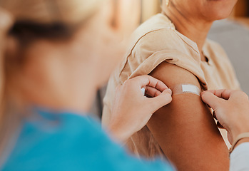 Image showing Healthcare, patient and plaster on arm for covid vaccine, flu shot or arthritis or osteoarthritis injection in hospital for health and wellness. Woman and nurse or doctor together during consultation