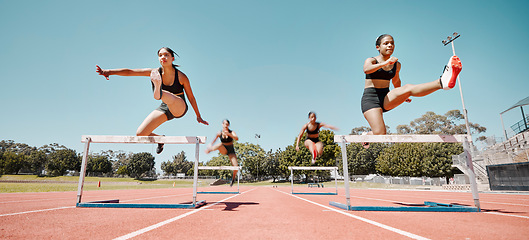 Image showing Woman, jumping and hurdles in competitive sports training, exercise or athletics on the stadium track. Women in sport fitness competition for hurdle jump, running and fast cardio exercising outside