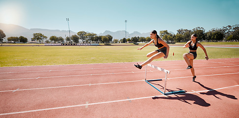 Image showing Athlete, runner and women in hurdles training for contest, race or together on circuit in mockup. Woman group, running and jump for teamwork, fitness or exercise in summer sunshine on outdoor track