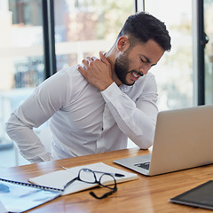 Image showing Man, shoulder pain and laptop while working in office suffering from stress, depression and burnout at desk. Arab businessman sitting to massage body feeling tired and fatigue