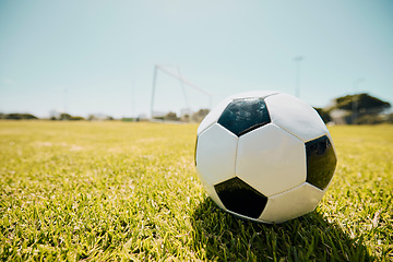 Image showing Soccer, sports and fitness with a ball on a grass pitch or field ready to a game or match outdoor during summer. Football, soccer ball and mockup with sport equipment at an outside competition venue