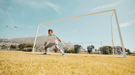 Image showing Boy, soccer field or goalkeeper in fitness game, exercise match or training competition in sports club, school ground or campus grass. Child, kid or football player in net post on park football field