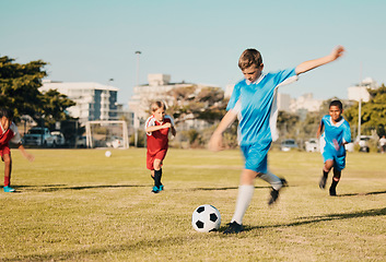 Image showing Soccer, boys running and kicking ball on field in summer, motivation and sports workout goals. Football, teamwork and growth, children playing game on grass soccer field in urban park with kids team.