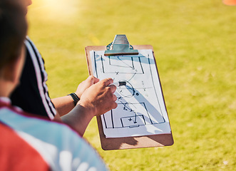 Image showing Clipboard, game planning and on field for soccer, sports and outdoor for competition with coach. Football, strategy and communication for instructions, talking and paper for match day formation.