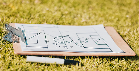 Image showing Clipboard, paper and soccer strategy, planning with tactics for team game plan and formation on a grass sport field. Document, pen and icon drawing, sketch and football plan for match on sports pitch