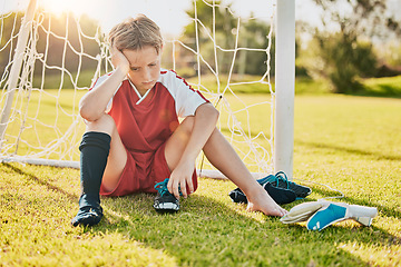 Image showing Sports, football loss and child sad over fitness game defeat, training competition fail or athlete contest. Kid depression, mental health problem and youth player depressed from soccer field bullying