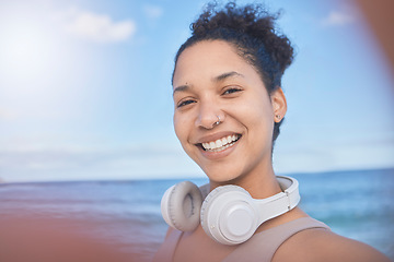 Image showing Woman, fitness selfie, happy at beach with smile for workout, exercise or training. Exercise, healthy or sports health influencer woman for wellness motivation for 5g social media post with headphone