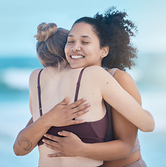 Image showing Friends, women and hug after exercise outdoor, happy and calm at the beach with love and fitness together. Support, trust and friendship, workout motivation by the ocean and wellness with zen smile.