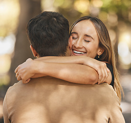 Image showing Hug, love and couple on a date in a park with a smile, happy and romantic in nature. Care, happiness and man and woman hugging for affection, missing and in marriage together in a forest in summer