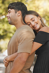 Image showing Nature, love and happy woman hugging her husband from behind while on a romantic outdoor date. Happiness, smile and couple from Mexico embracing with care while on walk in a green garden or park.