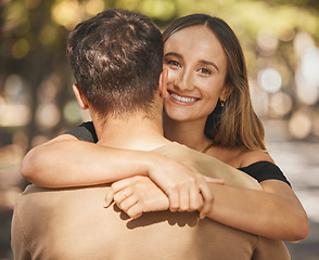 Image showing Couple, hug and love with support in a park, smile and happy on outdoor date together in summer. Portrait of trust, happiness and woman with man hugging with affection, care and compassion in nature