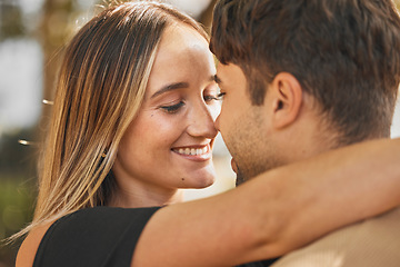 Image showing Couple, hug and love with happiness outdoor, romance and bonding with face together and nose touch. Happy, trust and romantic embrace, man and woman smile in marriage or dating relationship.