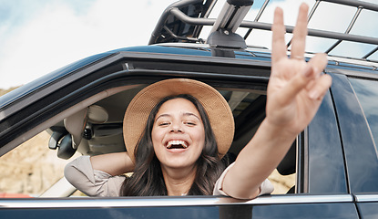 Image showing Road trip, car travel and woman, peace and sign for summer holiday, vacation and relax drive. Portrait traveling girl show fun peace sign in driving, journey and solo adventure, freedom and happiness
