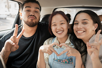 Image showing Friends, road trip and hand gesture with a man and woman group making peace and heart shape sign in a car. Diversity, travel and transportation with a male and female friend bonding in a vehicle