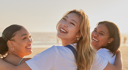 Image showing Portrait, hug and women friends at beach for vacation, holiday or summer trip. Back view, smile and happy people enjoying quality time outdoors, having fun and bonding together by sea or ocean shore.