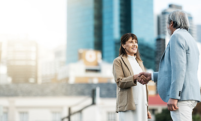 Image showing Business people, handshake and partnership deal in the city for agreement, trust or b2b in the outdoors. Woman and man shaking hands for greeting, business proposal or meeting idea startup on mockup