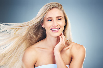 Image showing Beauty, hair care and portrait of happy woman in studio with long, healthy and blond hair. Health, cosmetics and model from Australia with beautiful hairstyle after keratin, botox or salon treatment.