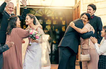 Image showing Family, wedding at church for the bride and groom hugging in celebration and happiness for marriage ceremony farewell. Happy married couple saying their good byes or celebrating together at the venue