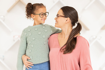 Image showing Mother, girl child and glasses in shop, happy with clear vision and eyesight with prescription specs. Healthcare, medical insurance and mom with smile and kid shopping for new spectacles or frames.