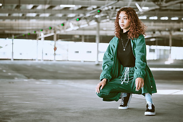 Image showing Youth, fashion and black woman with streetwear in an urban city parking lot for design, brand and hip hop lifestyle. Young woman, teenager or fashion model in designer clothes and sneakers outdoor
