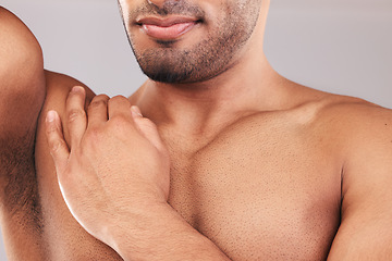 Image showing Beard, armpit and body skincare of man in studio isolated on a gray background. Hygiene, grooming and chest hair removal of muscular male fitness model, waxing and cleaning for wellness and beauty.