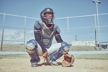 Image showing Baseball, fitness and catcher on a baseball field training for a sports game in an outdoor exercise workout in summer. Focus, wellness and healthy black man in safety gear with a secret hand gesture