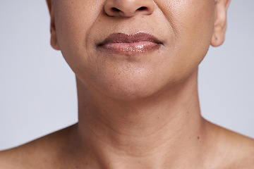 Image showing Beauty, skincare and lips of senior woman isolated in studio for wellness, healthy and natural skin. Makeup, cosmetic and face closeup of black woman for anti aging beauty products on gray background