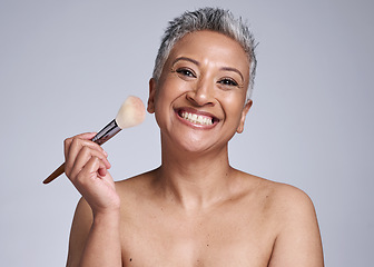Image showing Beauty, makeup and brush with senior woman for product, luxury and cosmetics. Foundation, blush and salon with portrait of mature model and smile for product self care, wellness and cosmetology