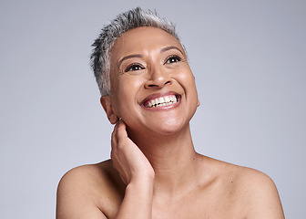 Image showing Face, beauty and antiaging with a senior woman in studio on a gray background to promote natural skincare. Wellness, luxury and cosmetics with a mature female posing for dermatology skin treatment