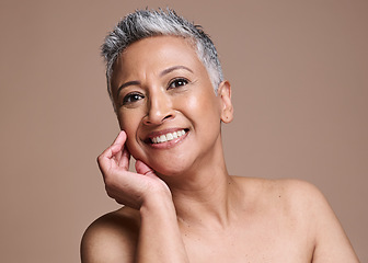 Image showing Face, skin and beauty with woman in antiaging skincare portrait, smile and healthy glow with cosmetics and dermatology against brown studio background. Facial, botox and treatment with makeup mockup.