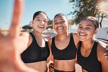 Image showing Selfie, sports and friends in collaboration at a stadium for fitness, running and marathon. Training, teamwork and hand of a woman with a photo with athlete group at a sport competition by a field