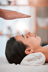 Image showing Reiki, hand and woman at a spa for relax, reiki healing and energy balance, peace and stress relief for wellness, health and mind. Reiki healing, massage and hands of alternative therapy for chakra