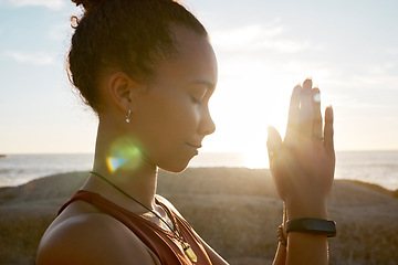 Image showing Meditation, beach flare and yoga girl meditate for spiritual balance, healthcare wellness or chakra energy healing. Namaste, nature sunset and training black woman with peace, freedom and zen mindset