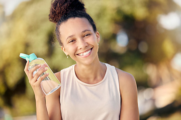 Image showing Water bottle, fitness and nature of black woman in portrait for outdoor exercise, wellness and healthy diet lifestyle in park or forest. Trees bokeh, workout and sports girl with drinking water gear