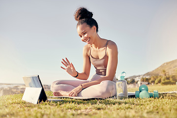 Image showing Fitness, woman and tablet call for yoga exercise, training or workout on the grass in the outdoors. Happy female waving for video call on touchscreen in spiritual wellness, zen or lifestyle in nature