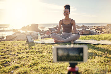 Image showing Yoga, meditation and technology with woman in nature for live streaming, peace or social media with phone and tablet. Relax, fitness or health with zen influencer by ocean for video, internet or blog