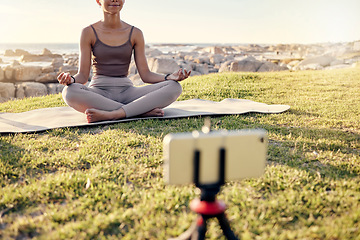 Image showing Yoga, meditation and live streaming woman in nature on smartphone for peace, healing and mindfulness content creation on social media. Influencer or fitness content creator meditate outdoor on video