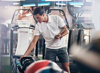 Image showing Gym, man and equipment clipboard with male manager checking weights in a health club for fitness. Exercise, workout and sports with a young man writing notes or list for a healthy, fit lifestyle