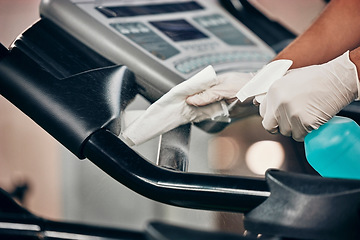 Image showing Hands, spray bottle and covid cleaning in gym for healthcare compliance, medical safety and global bacteria virus stop. Zoom, fitness or training center in covid 19 hygiene management for cleaner man