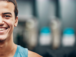 Image showing Portrait, happy fitness and man in gym for workout, training and sports motivation, mission and goals for marketing or advertising. Smile on face and vision of a young athlete with exercise wellness