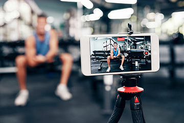 Image showing Gym, social media and fitness influencer with phone live streaming workout for interactive multimedia broadcast. Vlog, man filming arm exercise and training coach video recording online blog tutorial